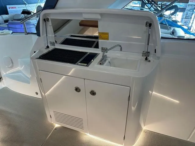Slide: The Image of 2024 Beneteau Gran Turismo 41 yacht kitchenette with sink and storage. - 7
