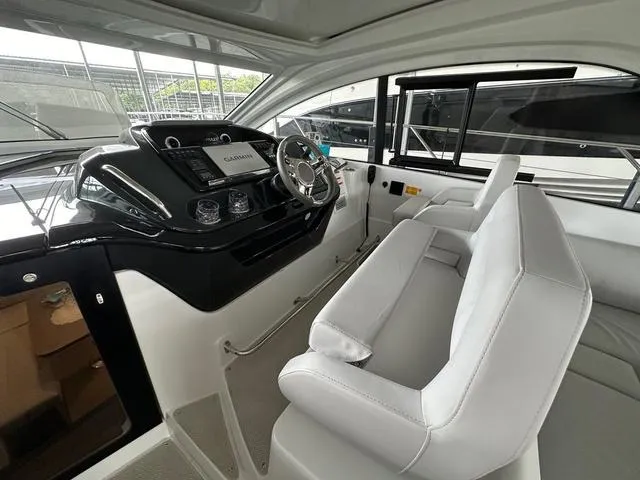 Slide: The Image of 2024 Beneteau Gran Turismo 41 cockpit with modern steering and navigation system. - 9