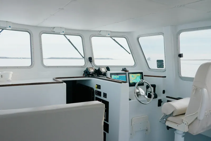 Slide: The Image of Interior of 2023 Millennium Marine NuWave 37 boat with modern navigation equipment. - 10