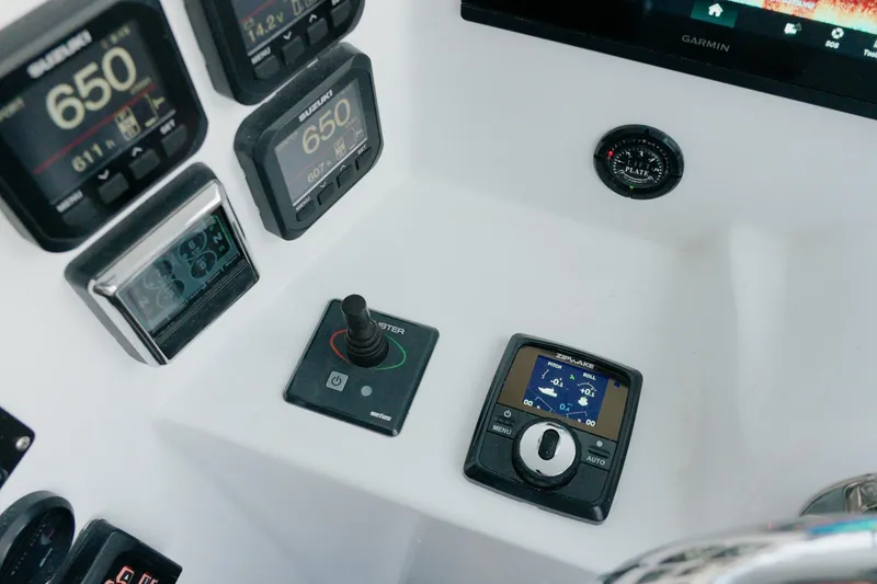 Slide: The Image of Millennium Marine NuWave 37 control panel with advanced navigation instruments, 2023 model. - 13