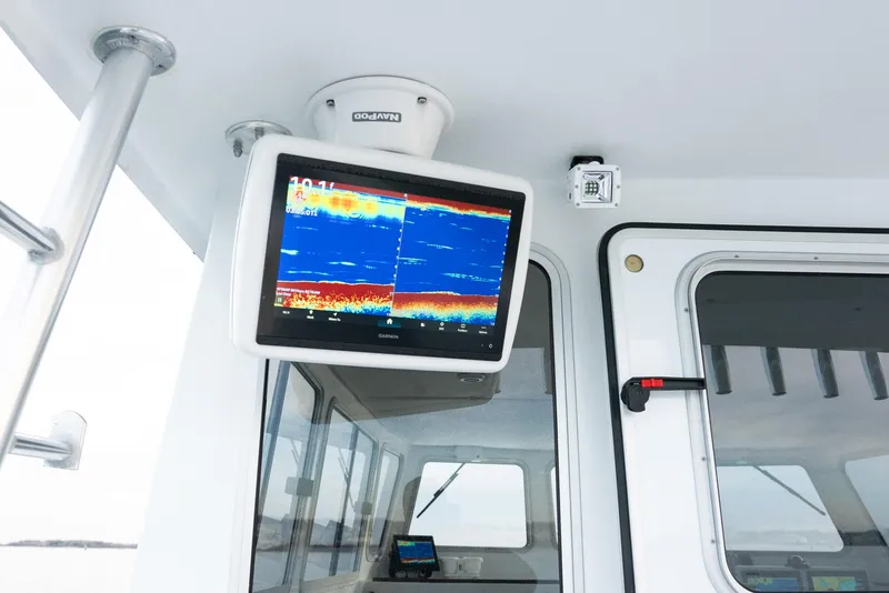 Slide: The Image of Millennium Marine NuWave 37 boat interior with advanced navigation display, 2023 model. - 19