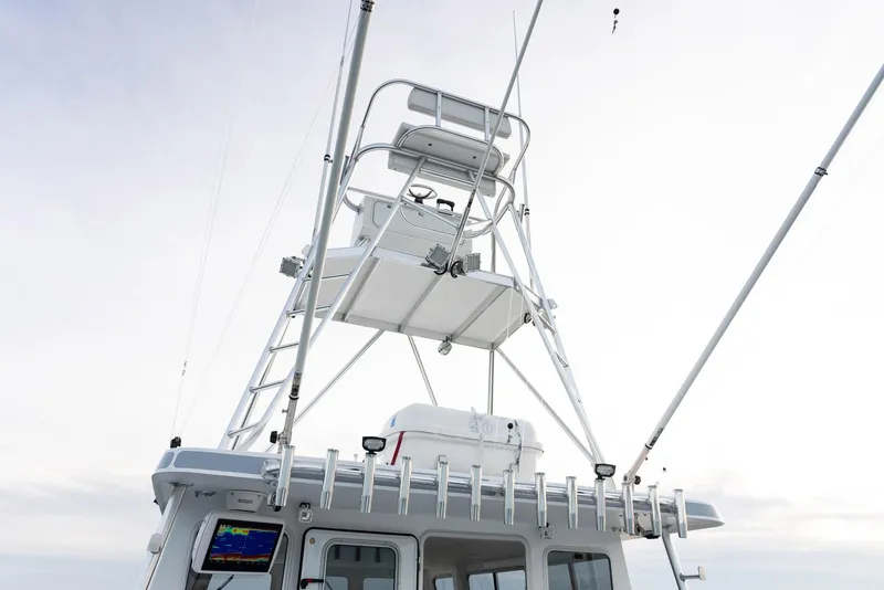 Slide: The Image of Millennium Marine NuWave 37 boat tower, 2023 model, with fishing rod holders and navigation equipment. - 22