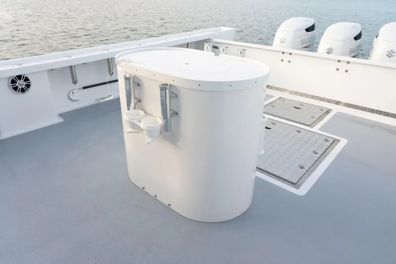 Slide: The Image of 2023 Millennium Marine NuWave 37 boat deck with storage unit and outboard motors. - 26