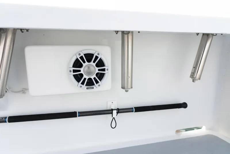 Slide: The Image of 2023 Millennium Marine NuWave 37 interior with speaker and fishing rod holder. - 30