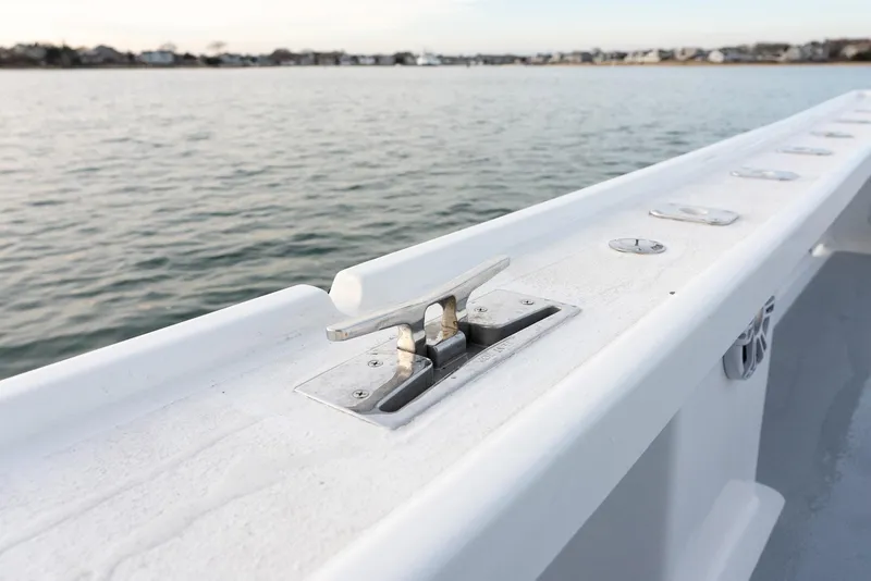 Slide: The Image of Millennium Marine NuWave 37 boat cleat, 2023 model, on calm water. - 32