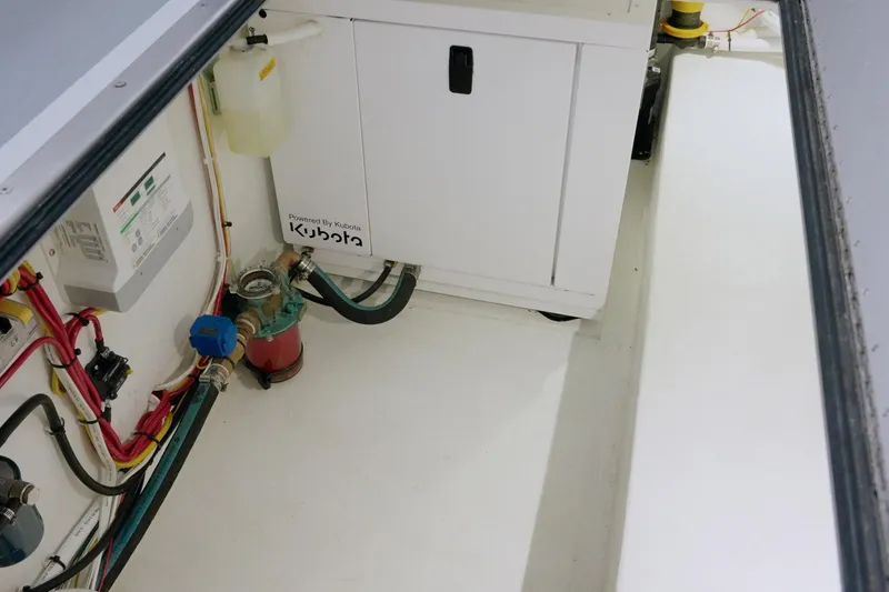 Slide: The Image of Engine compartment of 2023 Millennium Marine NuWave 37 with wiring and equipment. - 34