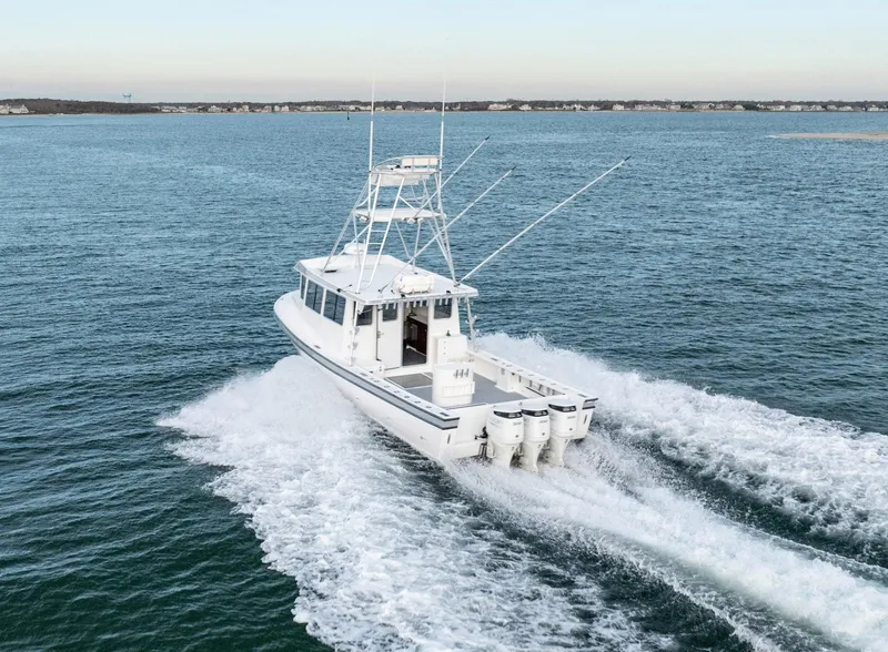 Slide: The Image of Millennium Marine NuWave 37 boat cruising on open water, 2023 model. - 35