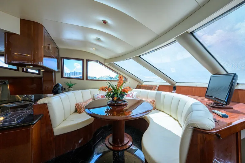 Slide: The Image of Luxurious interior of 2005 Marquis 65 MY yacht with elegant seating and panoramic windows. - 12