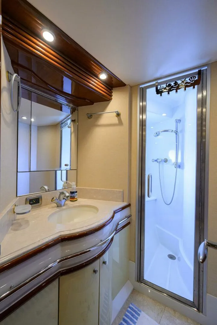 Slide: The Image of Luxurious bathroom in 2005 Marquis 65 MY yacht with modern shower and elegant vanity. - 25