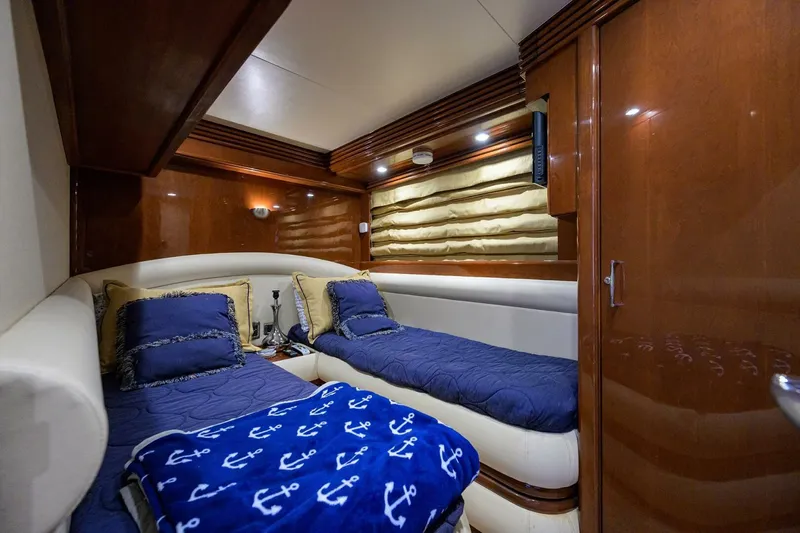 Slide: The Image of Luxurious 2005 Marquis 65 MY yacht cabin with twin beds and nautical decor. - 26
