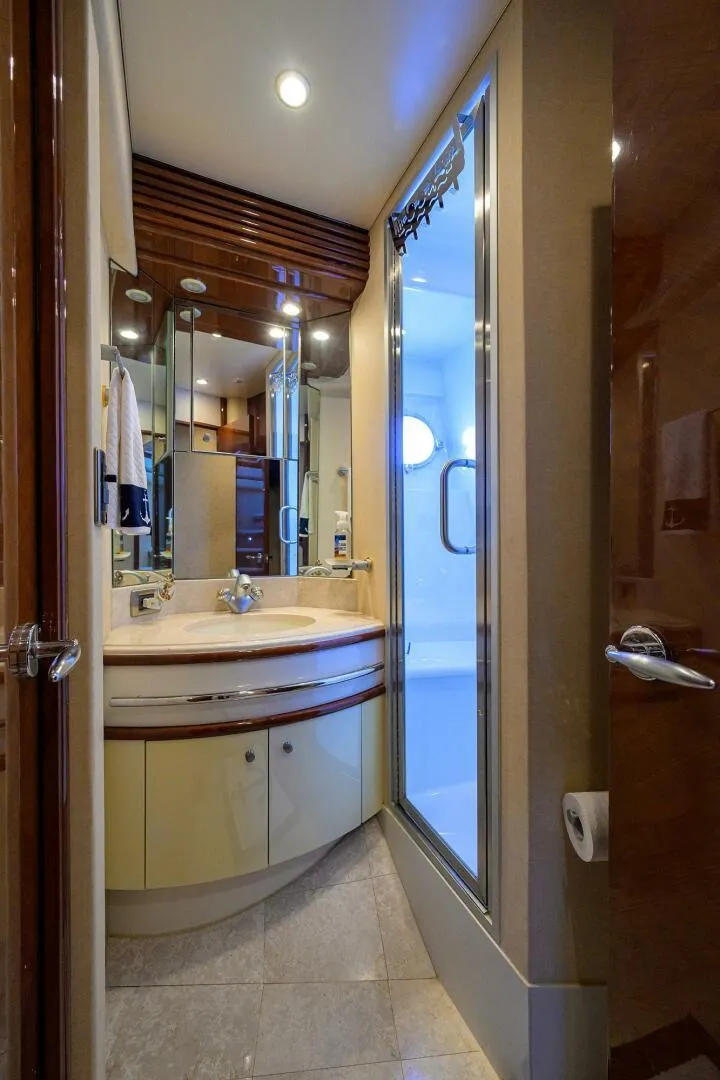 Slide: The Image of Luxurious bathroom in 2005 Marquis 65 MY yacht with modern fixtures and elegant design. - 28