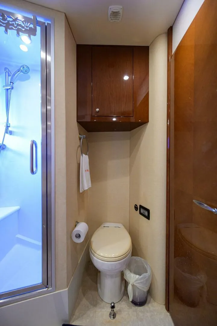 Slide: The Image of Luxurious bathroom in 2005 Marquis 65 MY yacht with shower and wooden cabinetry. - 29