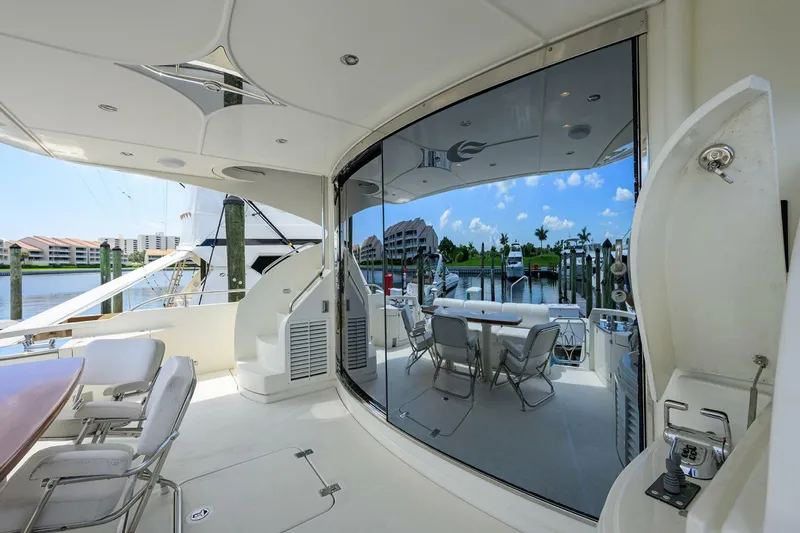 Slide: The Image of Luxurious 2005 Marquis 65 MY yacht interior with elegant seating and waterfront view. - 33