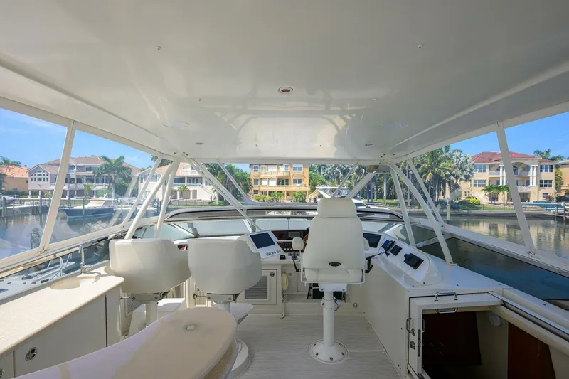 Slide: The Image of Interior view of 2005 Marquis 65 MY yacht helm with seating and controls. - 36