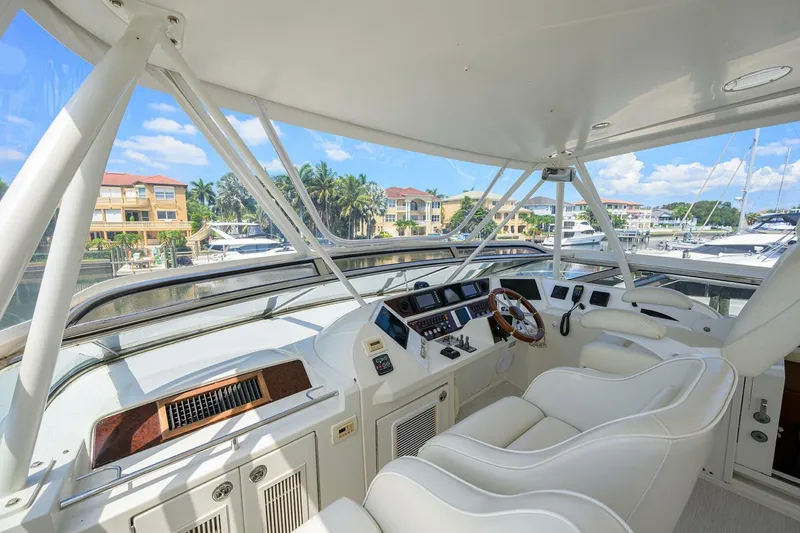 Slide: The Image of Luxurious 2005 Marquis 65 MY yacht helm with modern controls and plush seating. - 38