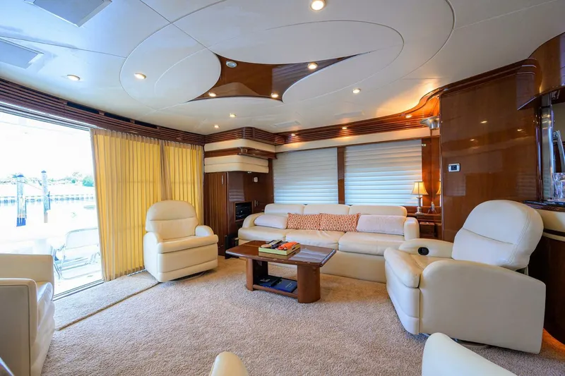 Slide: The Image of Luxurious interior of 2005 Marquis 65 MY yacht with plush seating and elegant decor. - 5
