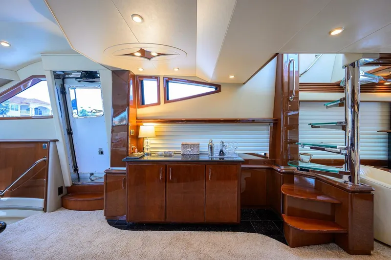 Slide: The Image of Luxurious interior of 2005 Marquis 65 MY yacht with elegant wood cabinetry and modern lighting. - 9