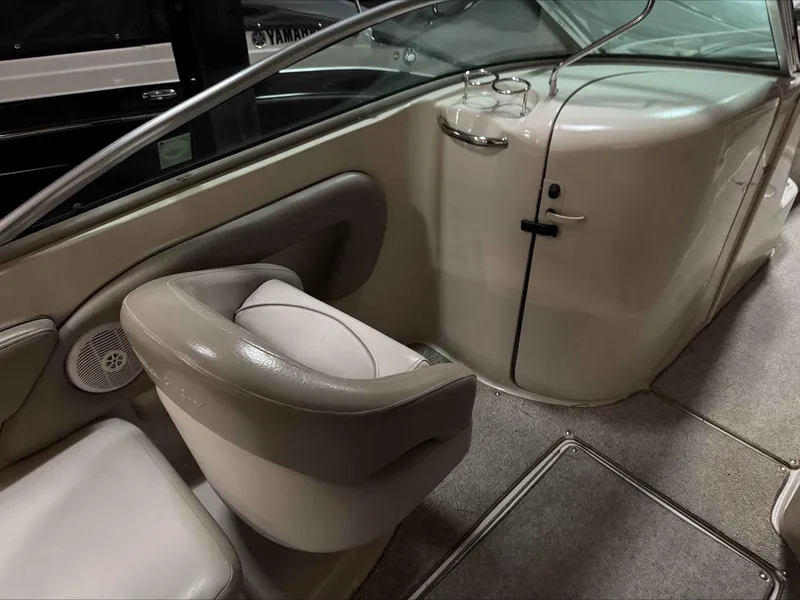 Slide: The Image of Interior of 2003 Sea Ray 240 Sundeck boat, featuring seating and storage area. - 22