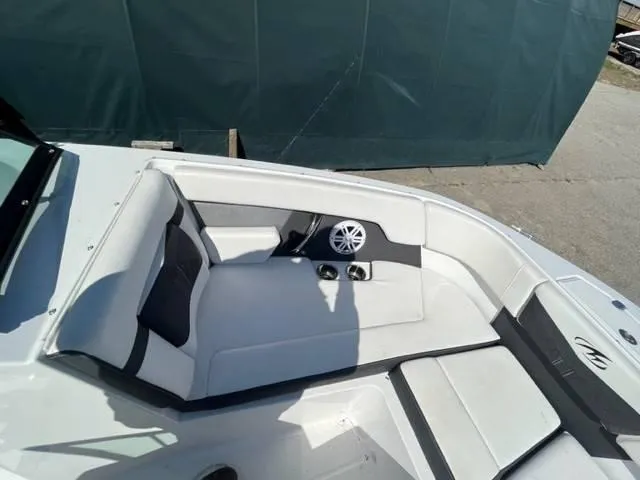 Slide: The Image of 2022 Monterey M22 boat interior with white seating and speaker system. - 7