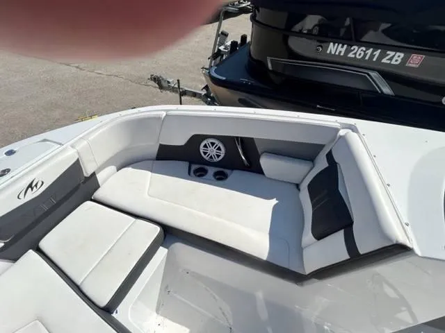 Slide: The Image of 2022 Monterey M22 boat interior with white seating and speaker system. - 8