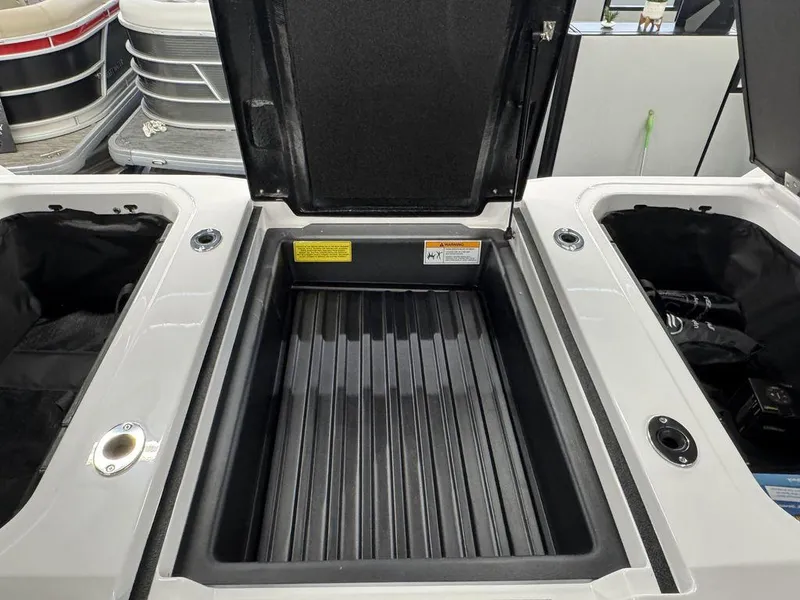 Slide: The Image of Open storage compartment in 2025 Moomba Max boat, showcasing interior design and functionality. - 7