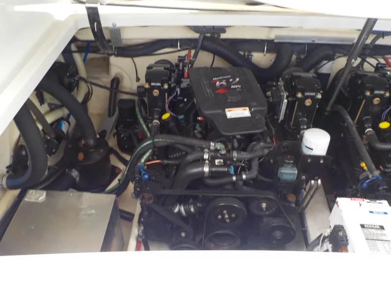 Slide: The Image of Engine compartment of 2006 Formula 330 SS boat, showcasing dual engines and components. - 14