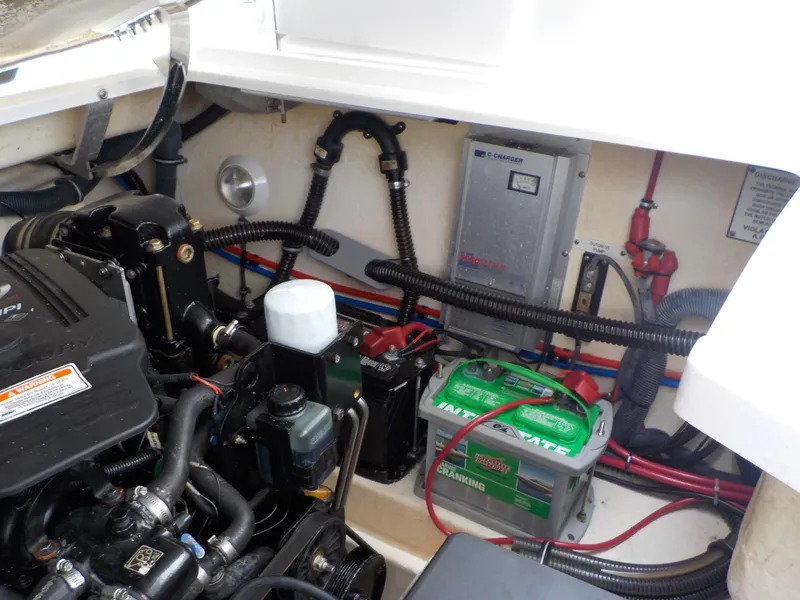Slide: The Image of Engine compartment of 2006 Formula 330 SS with battery and wiring. - 16