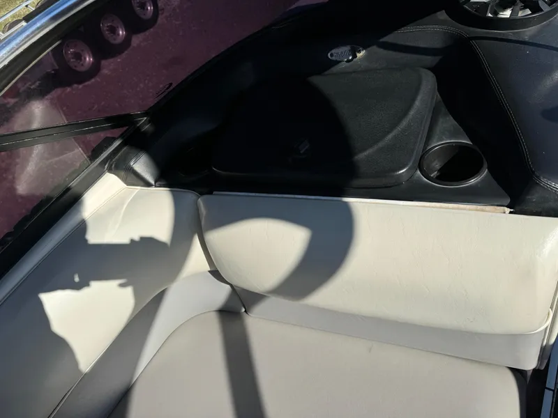 Slide: The Image of Interior of 2003 Malibu Wakesetter 23 XTi boat with white seating and black accents. - 11