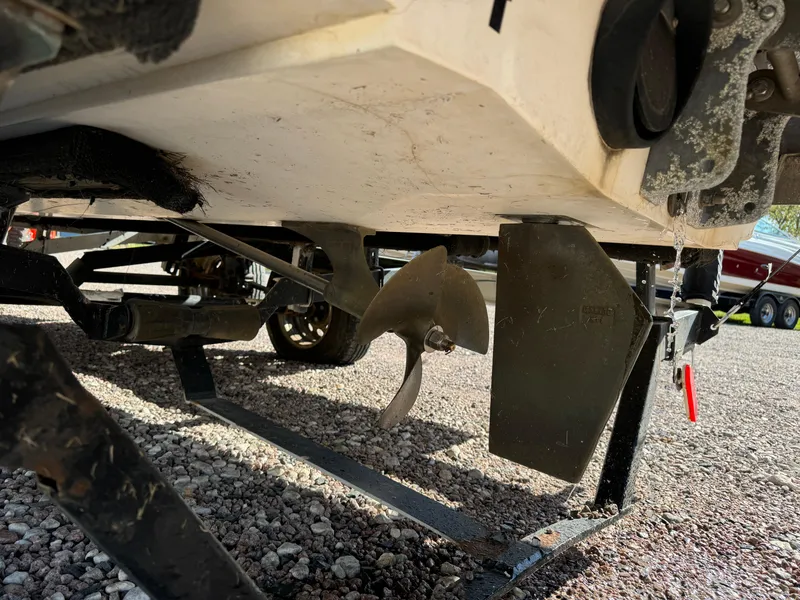 Slide: The Image of 2003 Malibu Wakesetter 23 XTi boat propeller and rudder on trailer. - 4