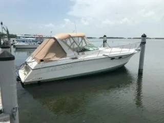 Slide: The Image of 1988 Wellcraft Gran Sport boat docked in calm waters. - 1