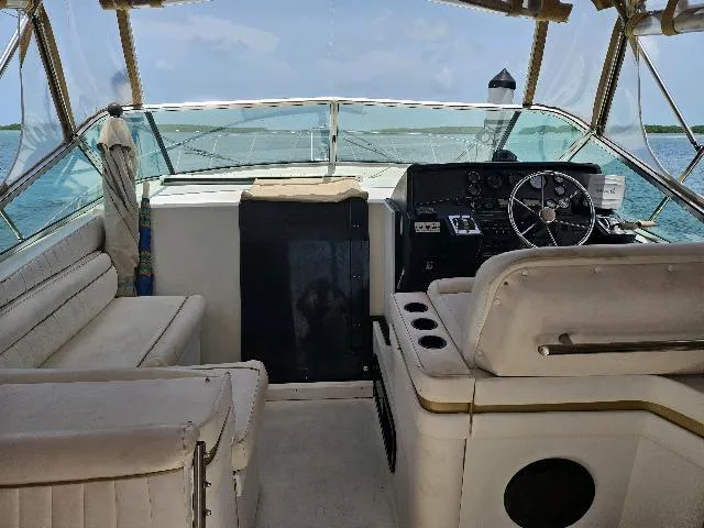 Slide: The Image of 1988 Wellcraft Gran Sport boat interior with steering wheel and seating. - 11