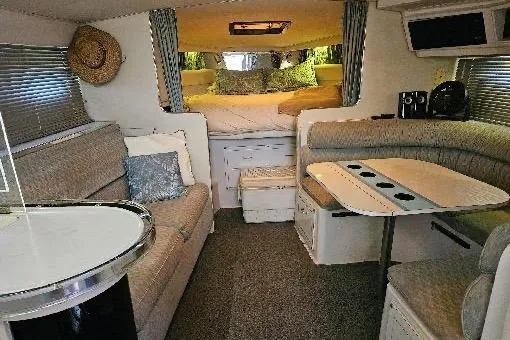 Slide: The Image of Interior of a 1988 Wellcraft Gran Sport boat with cozy seating and sleeping area. - 16