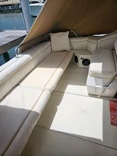 Slide: The Image of 1988 Wellcraft Gran Sport boat interior with white seating and cushions. - 7