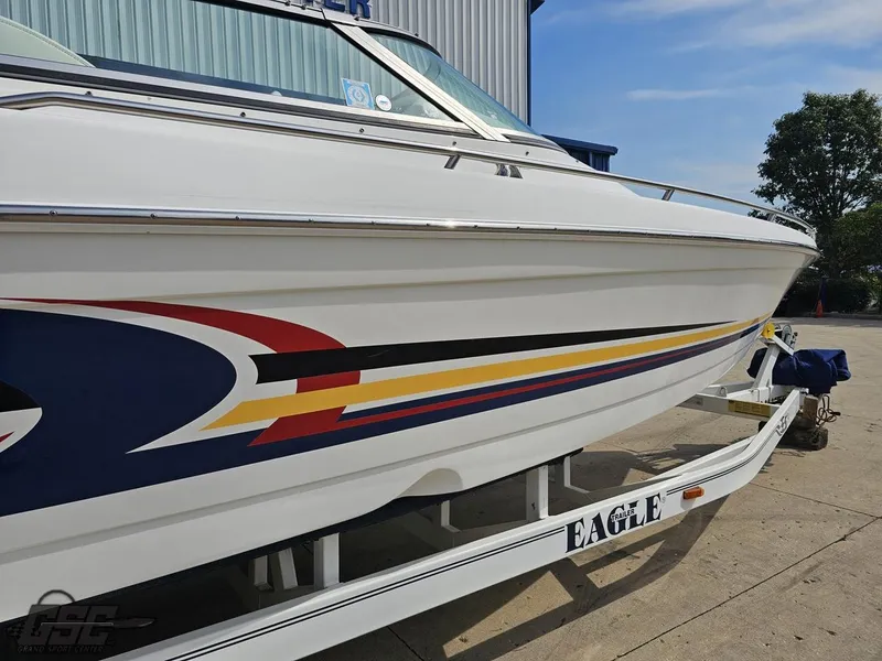 Slide: The Image of 2005 Formula 292 FASTech boat on trailer with colorful graphics. - 10
