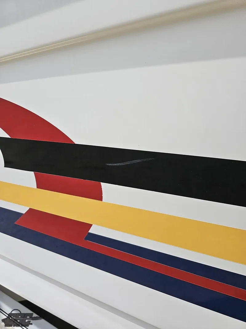 Slide: The Image of Close-up of 2005 Formula 292 FASTech boat with colorful stripe design. - 13