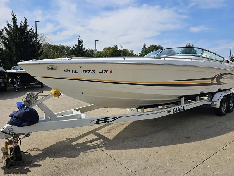 Slide: The Image of 2005 Formula 292 FASTech boat on trailer, parked outdoors. - 17