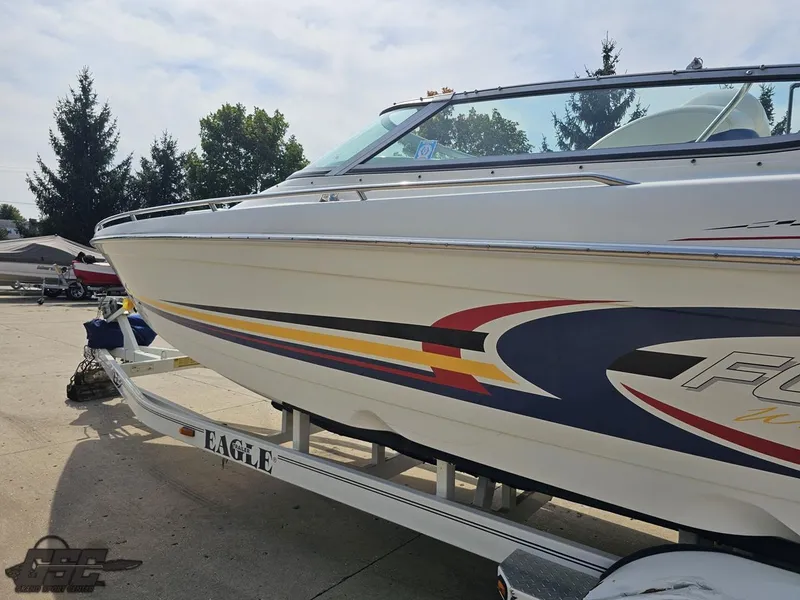 Slide: The Image of 2005 Formula 292 FASTech boat on trailer, featuring colorful graphics and sleek design. - 25