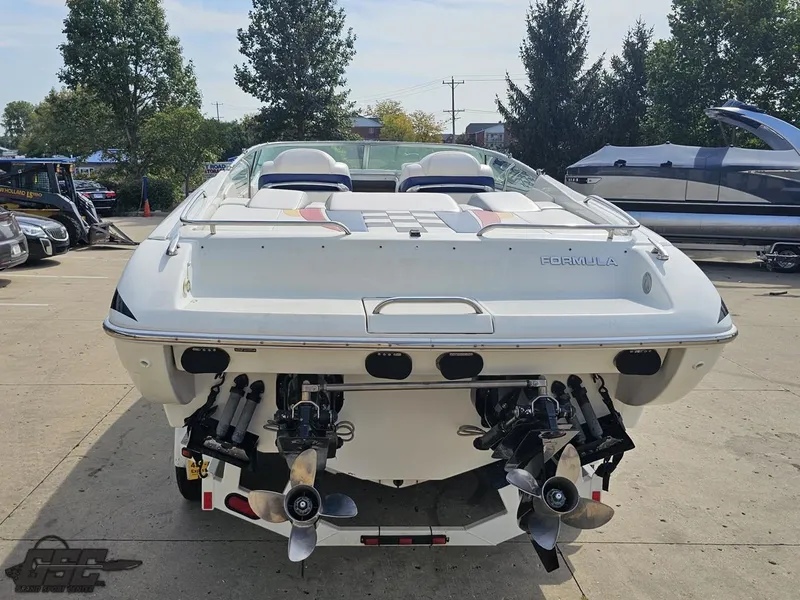 Slide: The Image of 2005 Formula 292 FASTech boat, rear view, dual propellers, parked outdoors. - 35