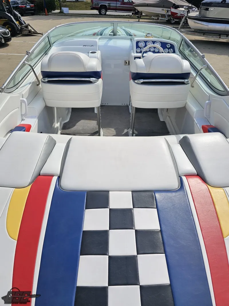 Slide: The Image of 2005 Formula 292 FASTech boat interior with colorful seating and checkered pattern. - 37