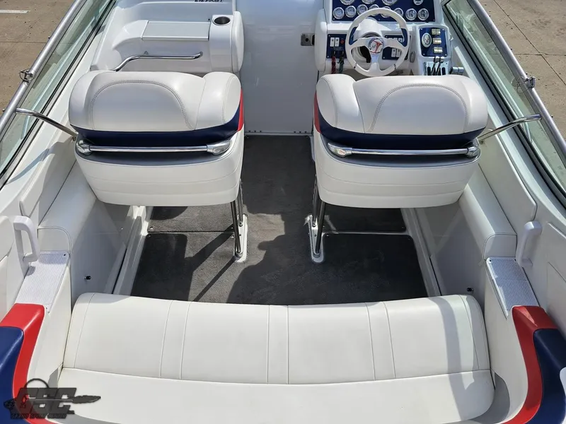 Slide: The Image of 2005 Formula 292 FASTech boat interior with white seating and modern dashboard. - 47