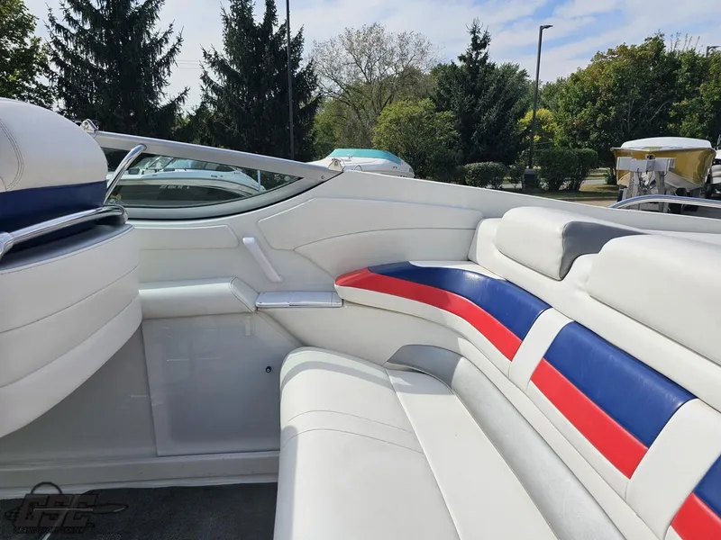 Slide: The Image of 2005 Formula 292 FASTech boat interior with white, red, and blue seating. - 48