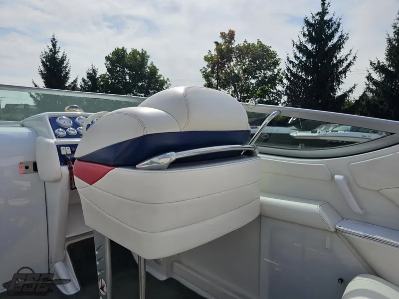 Slide: The Image of 2005 Formula 292 FASTech boat interior with white and blue seating. - 49
