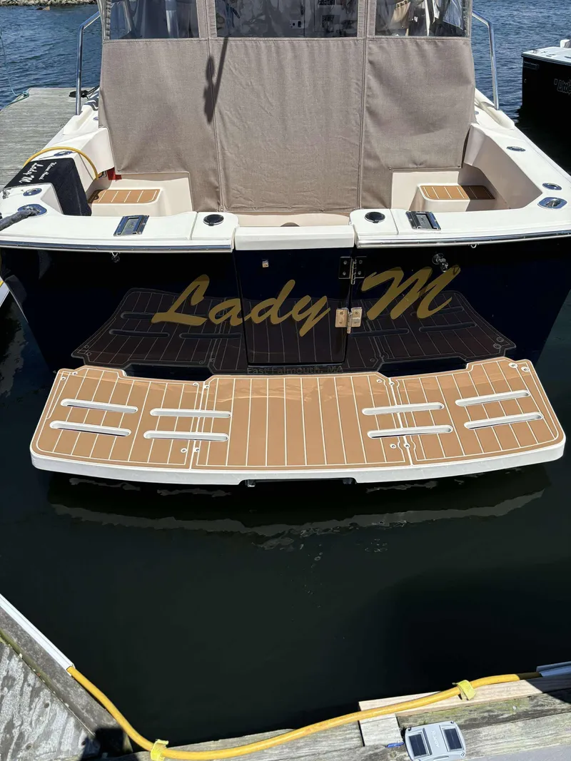 Slide: The Image of 2004 Mainship Pilot 30-II boat named "Lady M" docked at marina. - 3