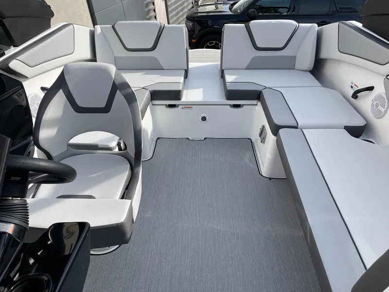 Slide: The Image of 2025 Yamaha Boats AR220 interior with modern seating and sleek design. - 13