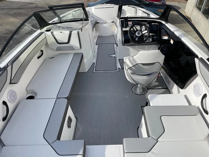 Slide: The Image of 2025 Yamaha Boats AR220 interior with sleek seating and modern dashboard design. - 6
