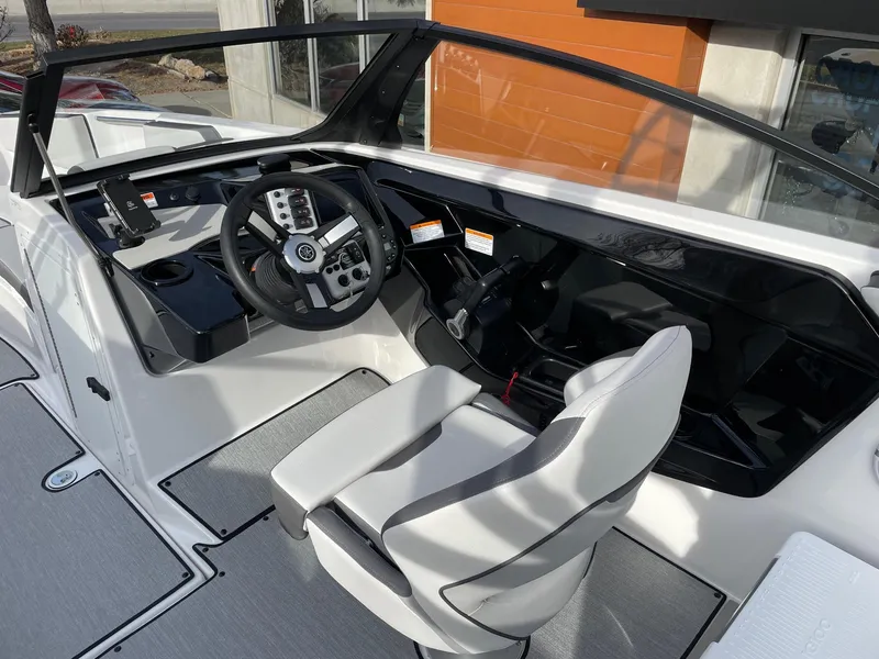 Slide: The Image of 2025 Yamaha Boats AR220 cockpit with modern steering and seating design. - 7