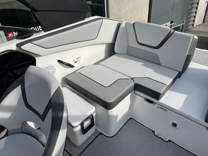 Slide: The Image of 2025 Yamaha Boats AR220 interior seating with modern gray upholstery. - 8