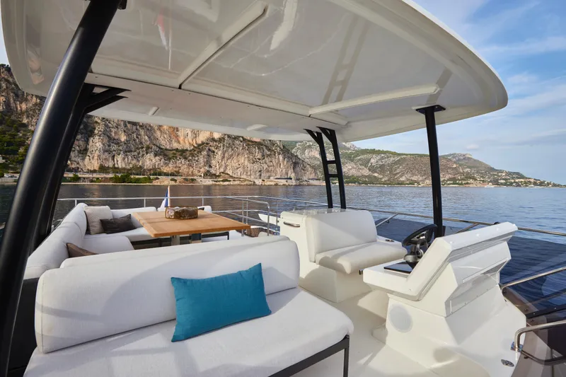Slide: The Image of Luxurious 2025 Prestige M48 yacht interior with scenic coastal view. - 17
