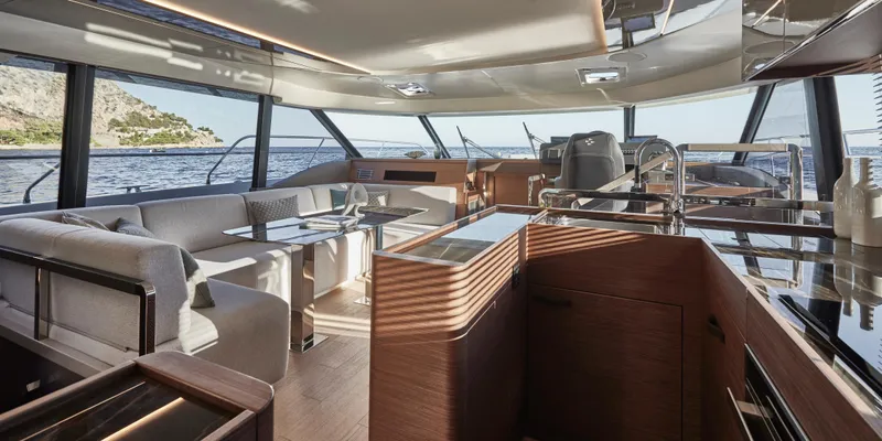 Slide: The Image of Luxurious interior of 2025 Prestige M48 yacht with modern furnishings and panoramic windows. - 22