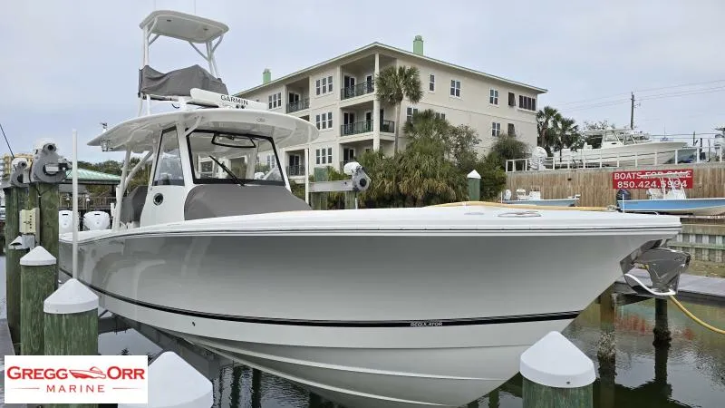 Slide: The Image of 2021 Regulator 41 boat docked at marina, Gregg Orr Marine branding visible. - 11